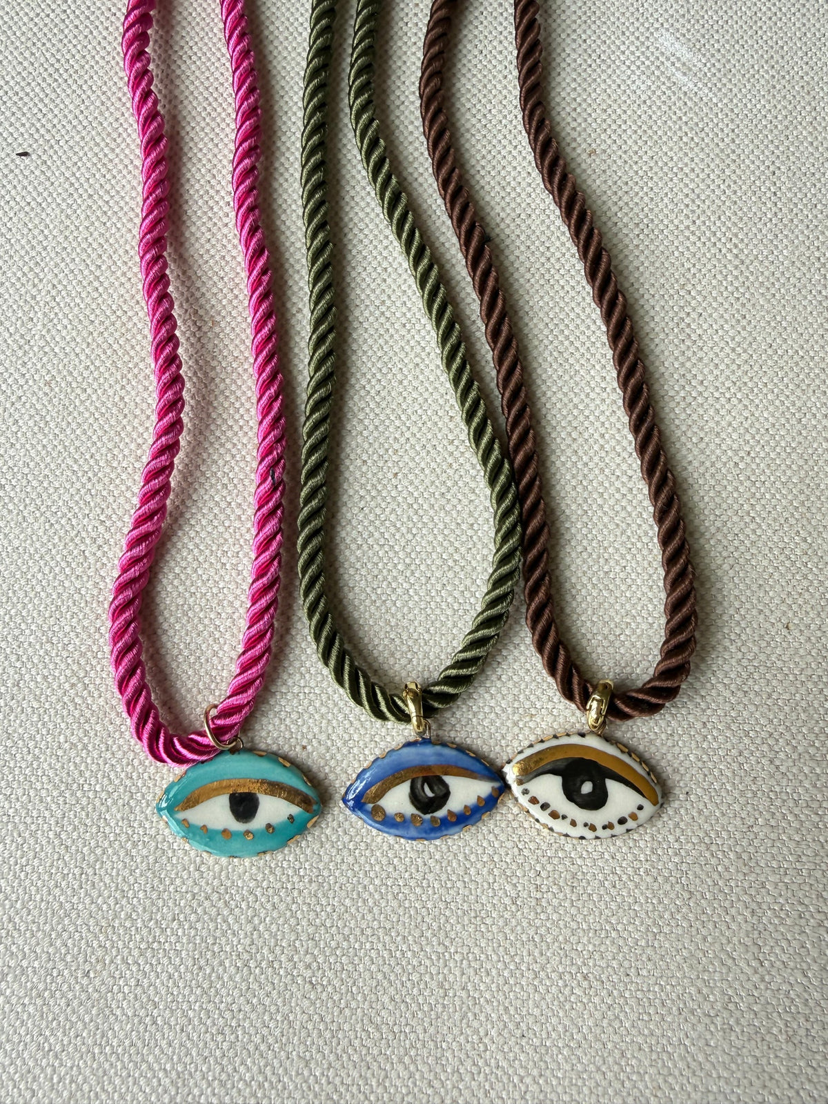 CERAMIC NOT SO EVIL EYE SILK ROPE NECKLACE